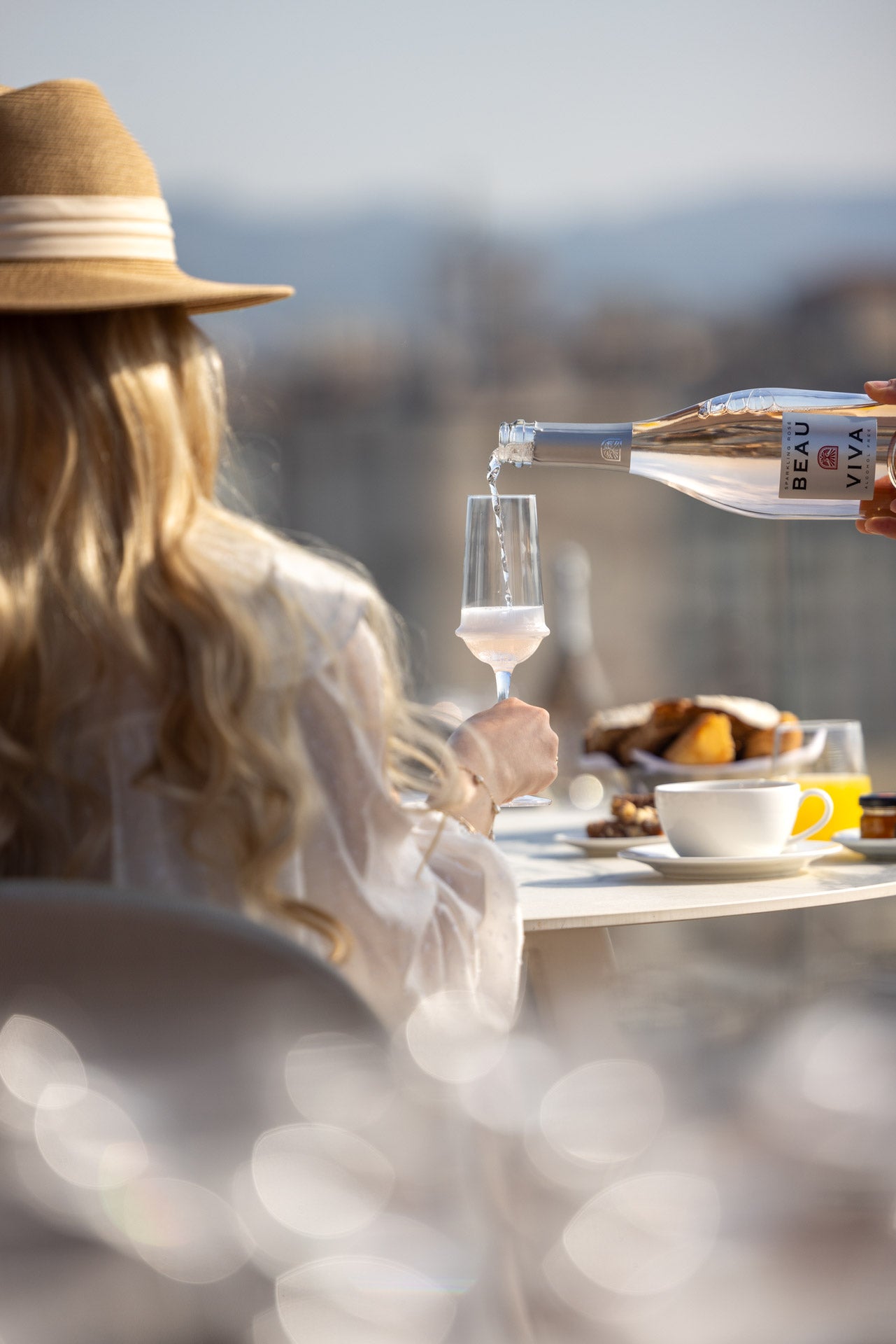 Woman enjoying alcohol-free wine indoors